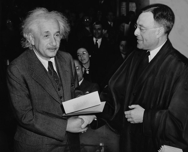 Albert Einstein receiving his his certificate of U.S. citizenship in 1940 from Judge Philip Forman. Photo courtesy Al Aumuller/Library of Congress.